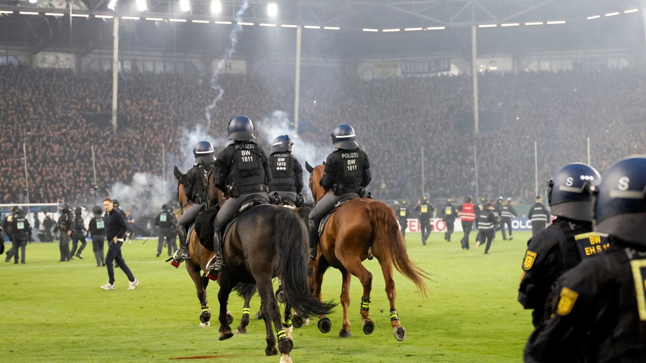 Fans and police injured in pitch invasion during ‘high risk’ German Cup tie