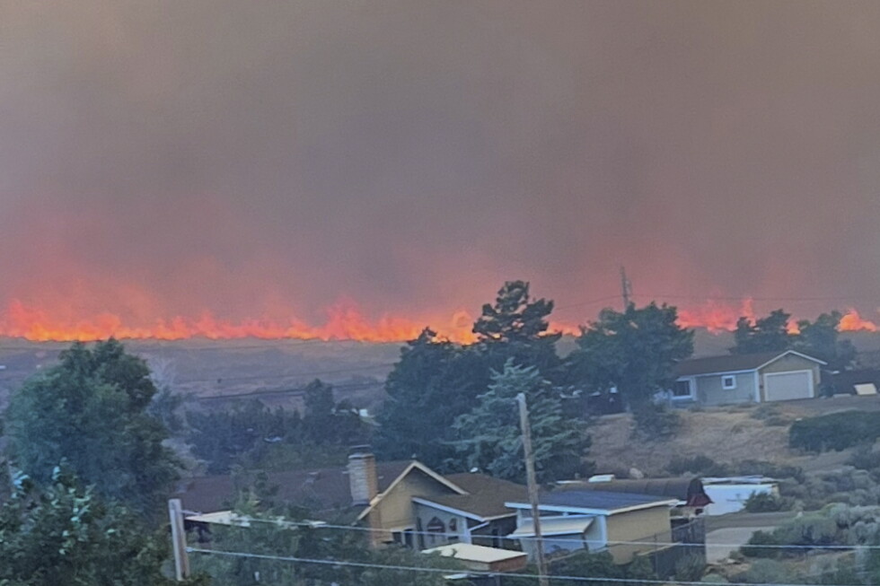 Wildfire started by humans approaches Reno, Nevada, forcing thousands of evacuations