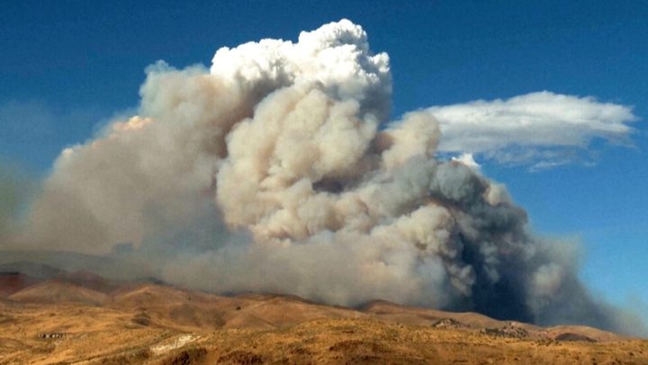 Firefighters make progress against a Nevada wildfire that’s destroyed more than 30 homes