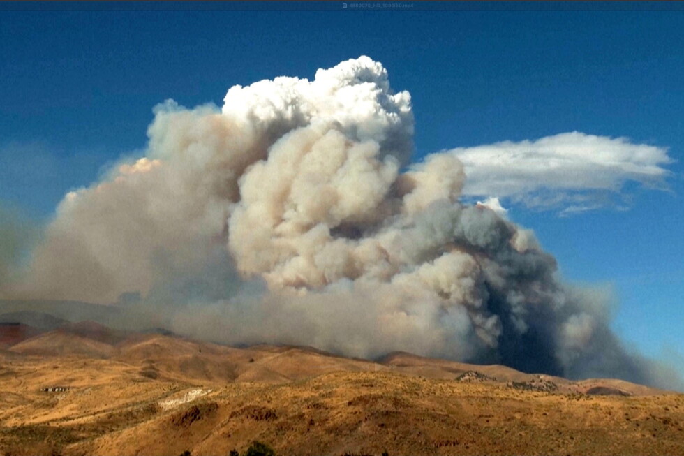 Firefighters make progress against a Nevada wildfire that's destroyed more than 30 homes