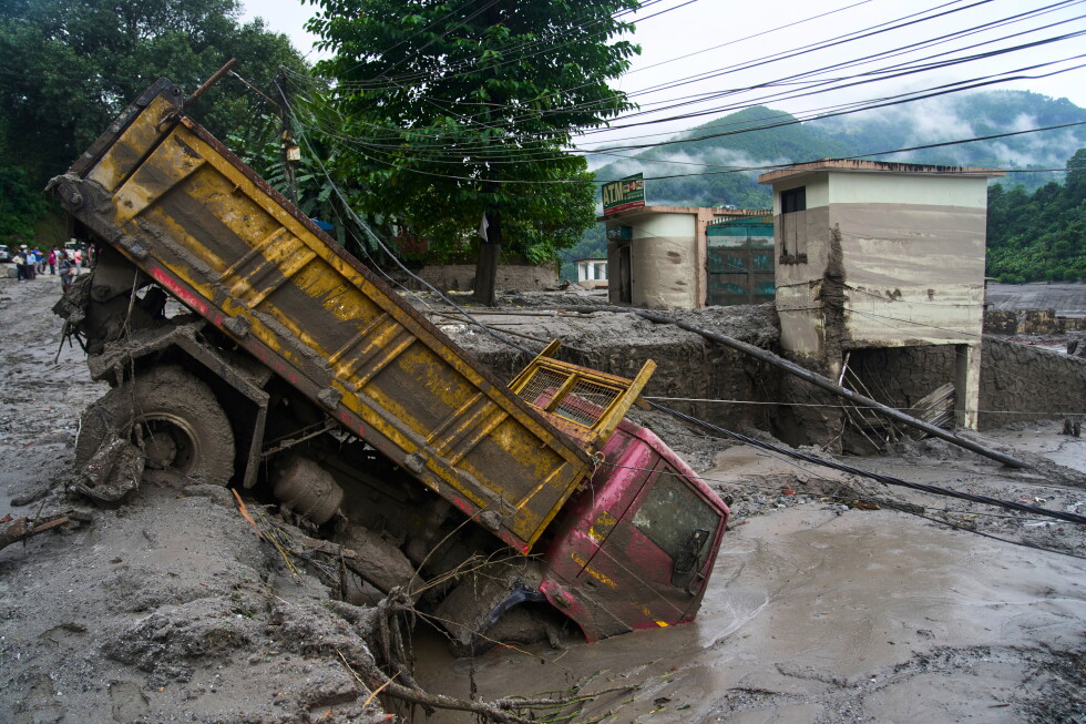 LIVE&nbsp;Death toll rises in Nepal-China border disaster as lake poses new flood threat
