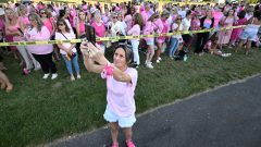 Women in pink rally in support of Lindsay Clancy at her trial for killing her 3 children