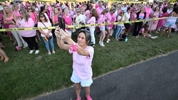 Women in pink rally in support of Lindsay Clancy at her trial for killing her 3 children