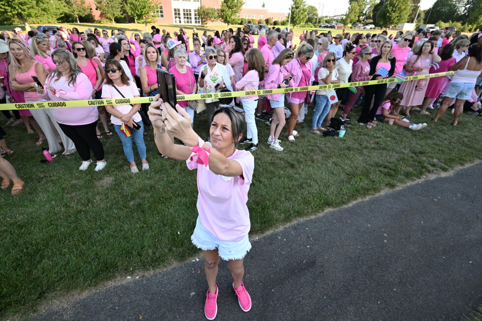 Women in pink rally in support of Lindsay Clancy at her trial for killing her 3 children
