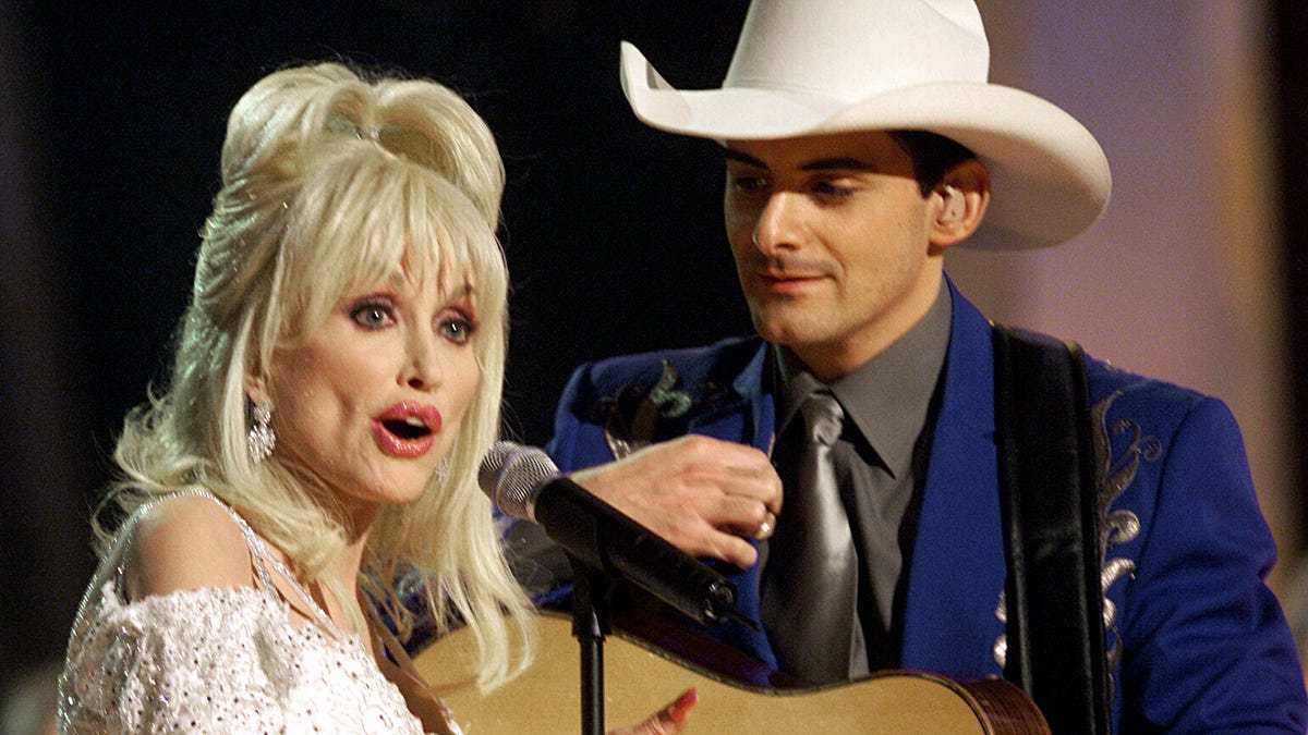 Brad Paisley fights tears singing Dolly Parton duet alone after her death