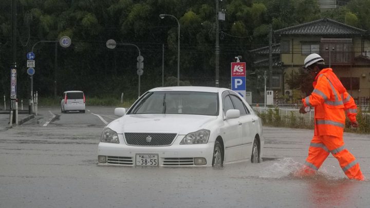 Heavy rain and flooding in north-central Japan strands people and vehicles