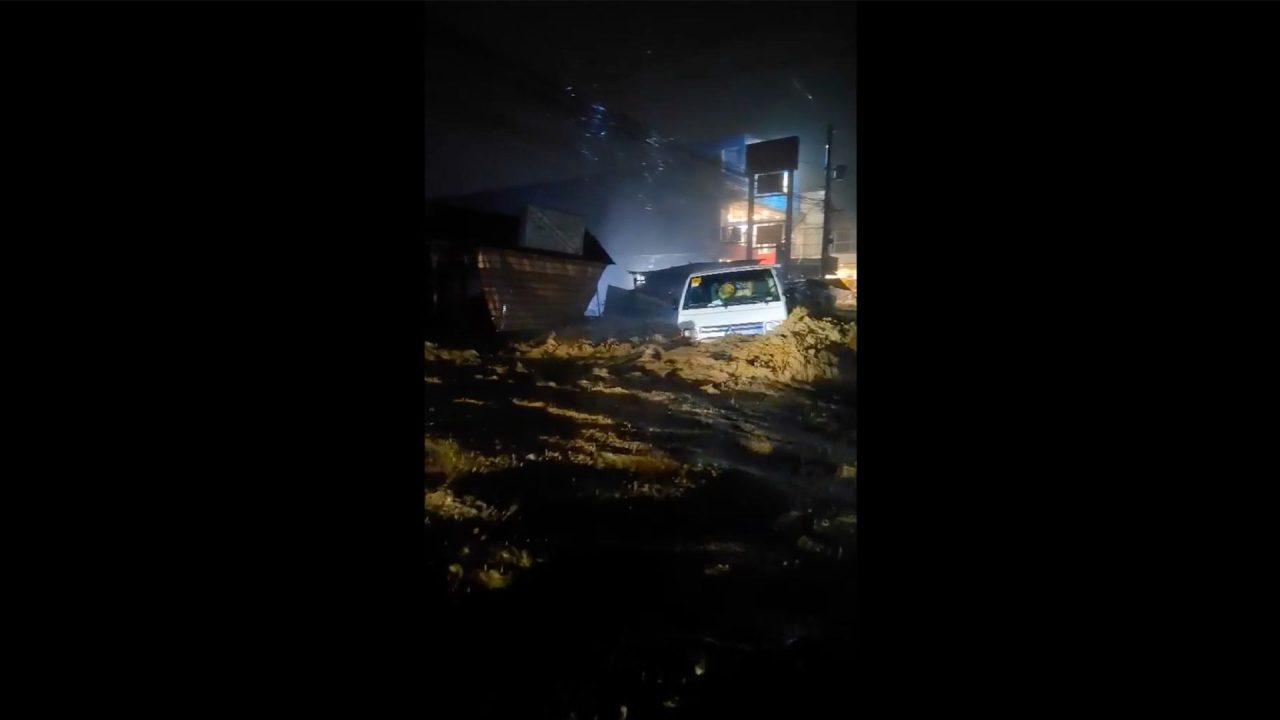 Video: Raging floodwaters sweep away lorry in the Philippines
