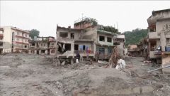 People return to their flood-ravaged homes in Nepal
