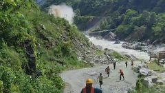 Terrifying moment workers flee for their lives as 50ft tsunami of mud thunders down valley at horror speed in Nepal
