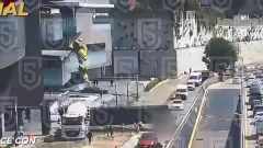 Terrifying moment massive billboard collapses crushing woman to death inside car as pedestrians sprint to safety