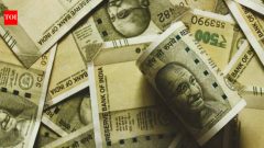India BusinessRupee falls 13 paise to 95.56 as crude rises, Fed hike bets strengthen dollar