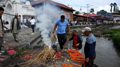 'We had to do this to set his soul free': Families hold symbolic funerals in Nepal for missing flood victims