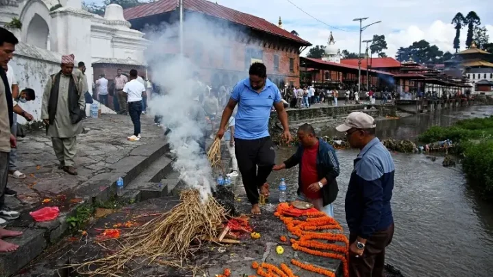 'We had to do this to set his soul free': Families hold symbolic funerals in Nepal for missing flood victims
