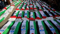 Photos: Gaza holds funeral for 100 Palestinians recovered from rubble