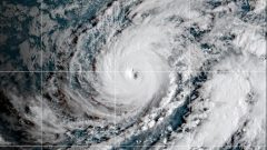 Hawaii residents told to expect tropical storm conditions as Hurricane Lowell passes to the west