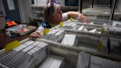 Ballots discounted for late postmarks surged in Washington and Oregon after Postal Service changes