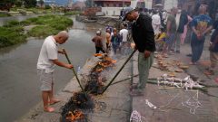Symbolic funerals held in Nepal for those feared lost as some missing tourists make contact