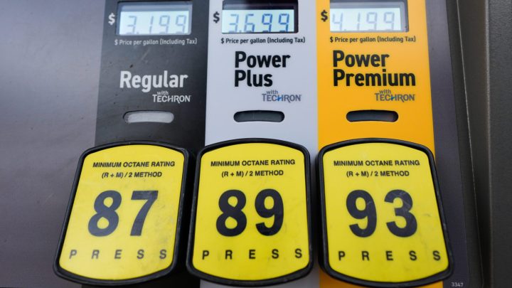 Inflation cooled slightly last month even as consumers stepped up spending