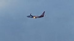Flames burst from Qantas plane engine after New Zealand takeoff