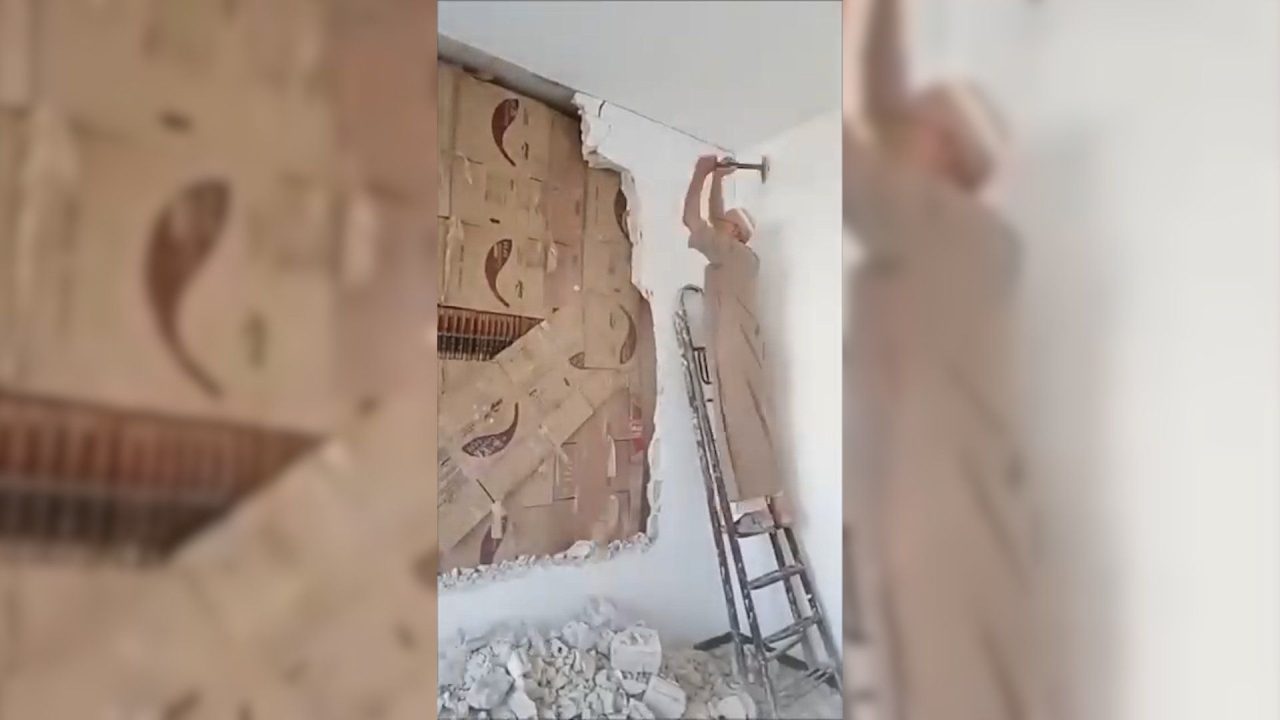 Syrian man uncovers library hidden behind wall for 15 years