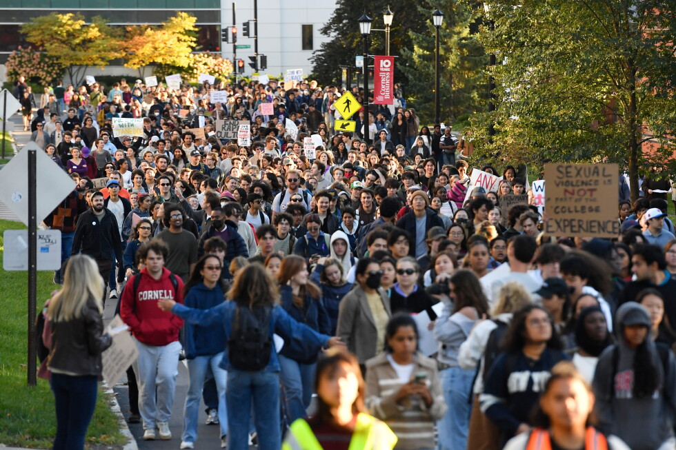 A crowd of students protest Cornell's response to gang rape complaint