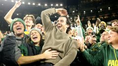 Brewers bring World Series trophy to Packers game, Sal Frelick does Lambeau Leap