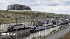 Bus hits train stopped on French side of  Channel Tunnel, with 19 injured