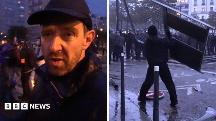 Fireworks and tear gas as protesters and riot police clash in Paris