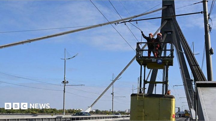 Kyiv bridge hit in further drone attack as German chancellor makes surprise visit