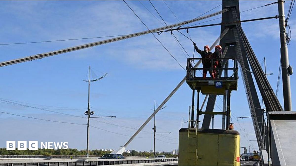 Kyiv bridge hit in further drone attack as German chancellor makes surprise visit