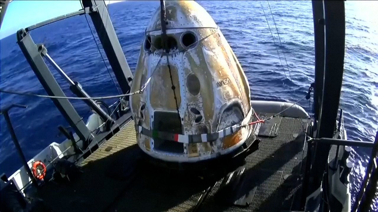 Four astronauts return to earth after an eight-month space mission