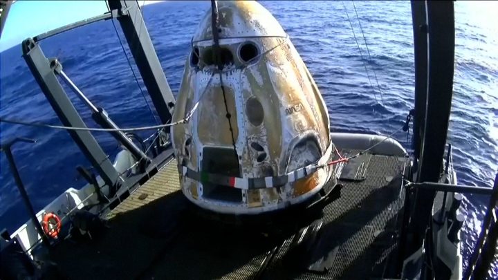 Four astronauts return to earth after an eight-month space mission