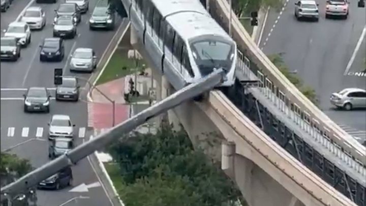 Train slams into crane that collapsed onto railway line in Brazil